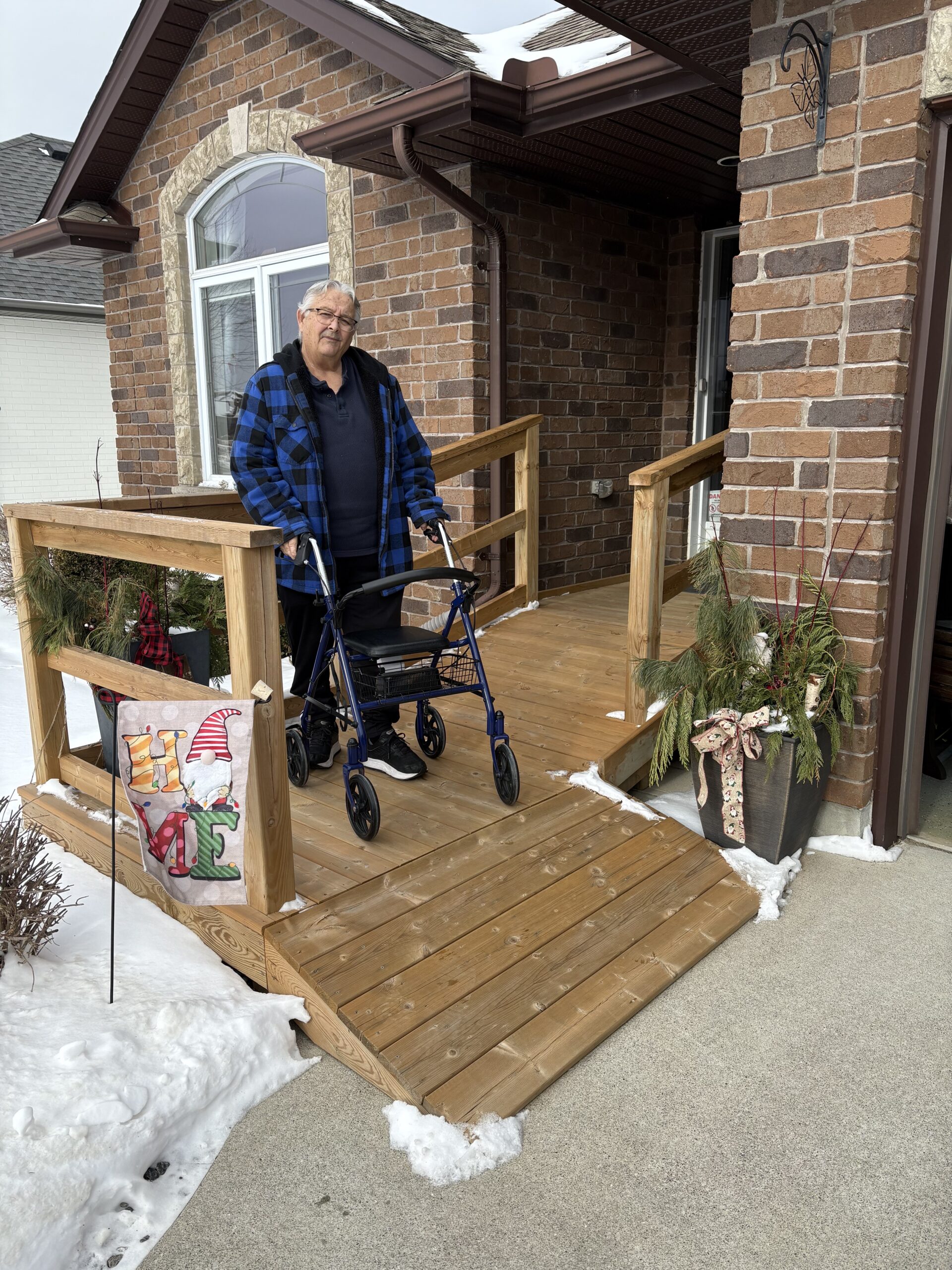 Mavis standing outside her home she bought from Habitat Canada