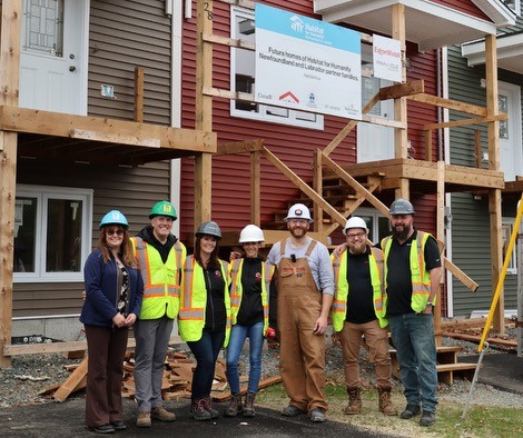 Mavis standing outside her home she bought from Habitat Canada