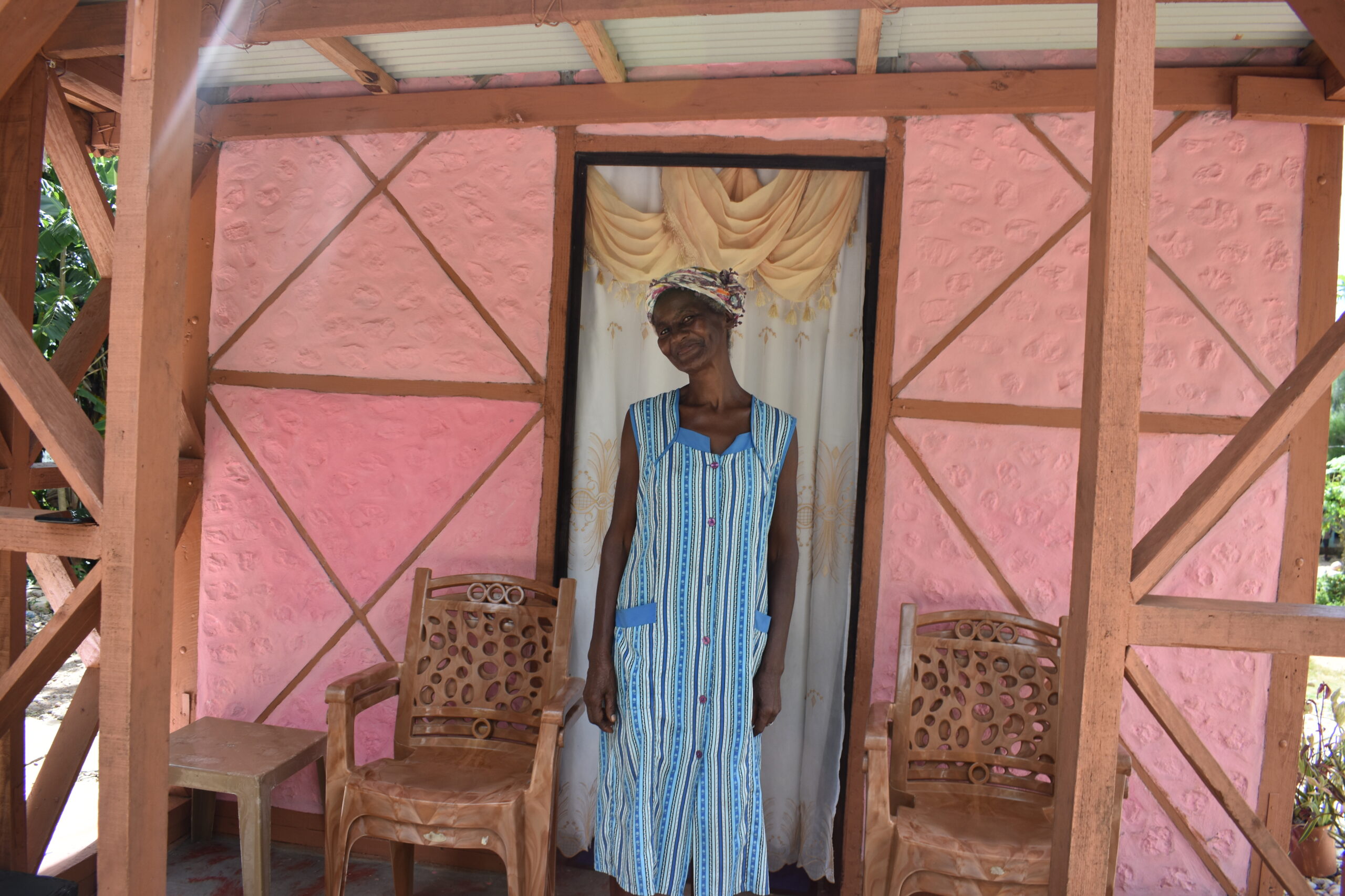 Mavis standing outside her home she bought from Habitat Canada